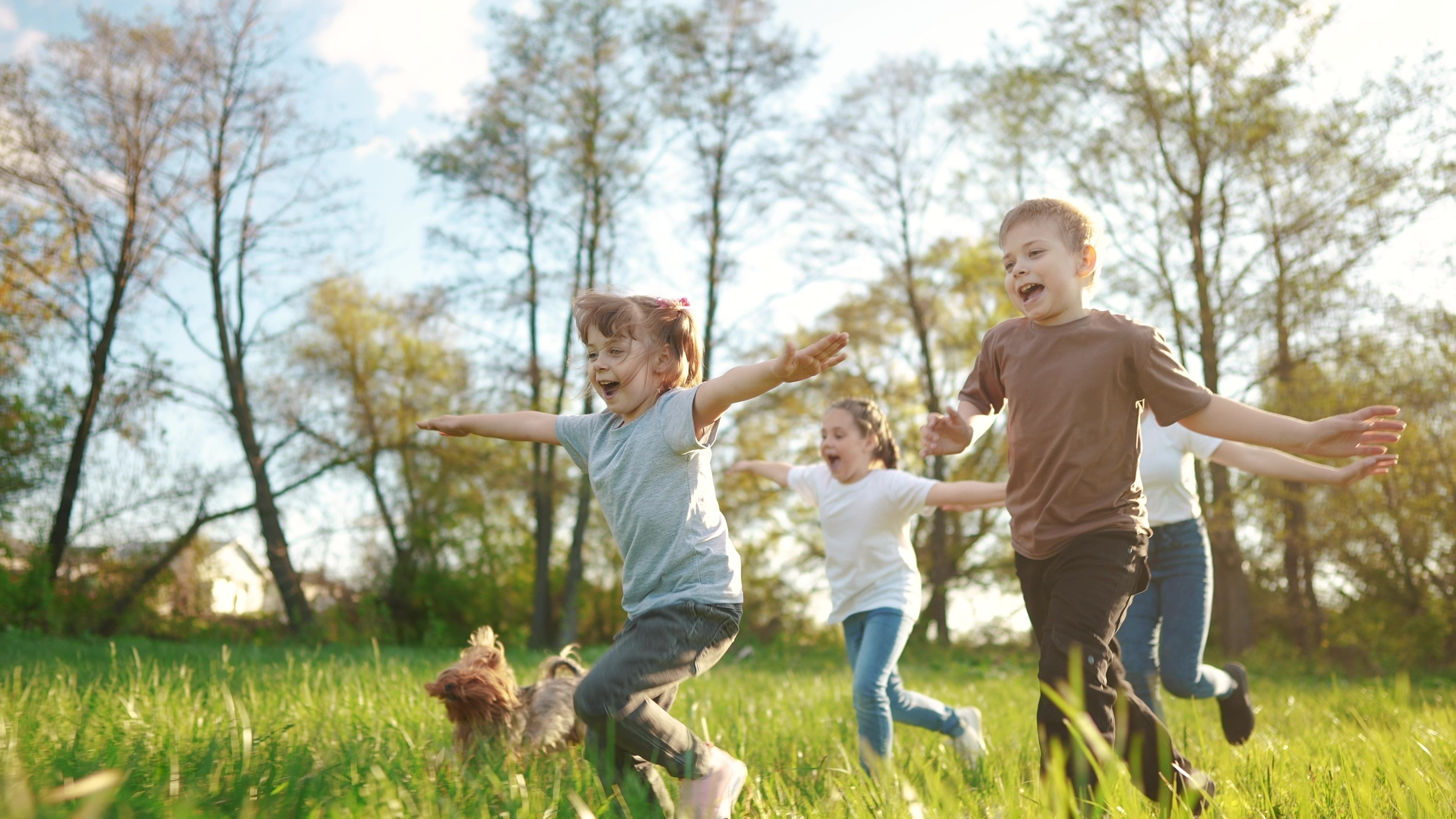 Children running in a field.